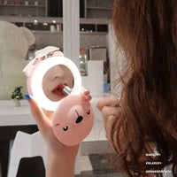 PiggyGlow: Cartoon Pig LED Mirror Pocket Fan for Makeup, Touch-Ups & Cooling - Juggledrops