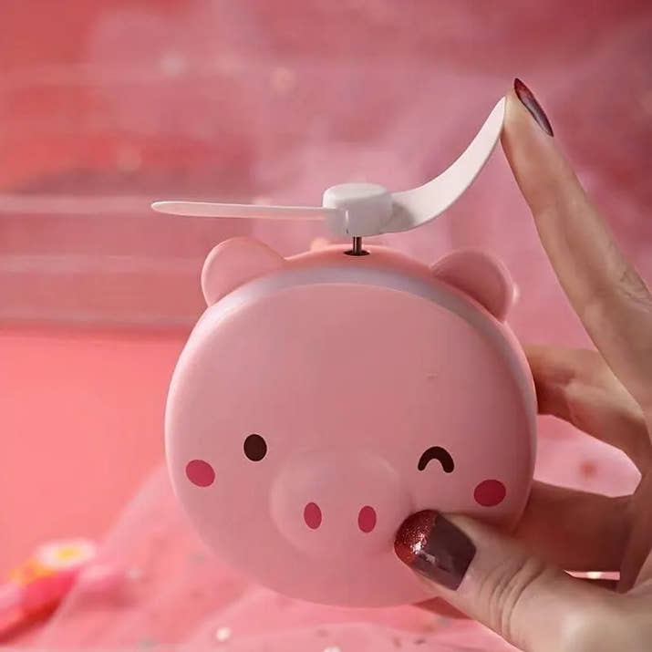 PiggyGlow: Cartoon Pig LED Mirror Pocket Fan for Makeup, Touch-Ups & Cooling - Juggledrops