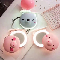 PiggyGlow: Cartoon Pig LED Mirror Pocket Fan for Makeup, Touch-Ups & Cooling - Juggledrops